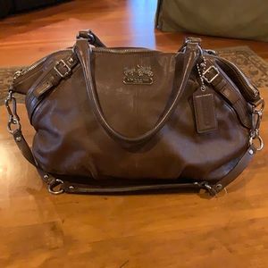 Coach brown leather with silver hardware and lavender lining w/ zip closure
